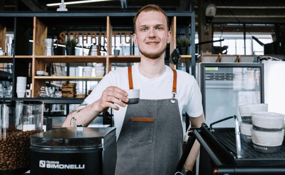 cafe employee drinking coffee